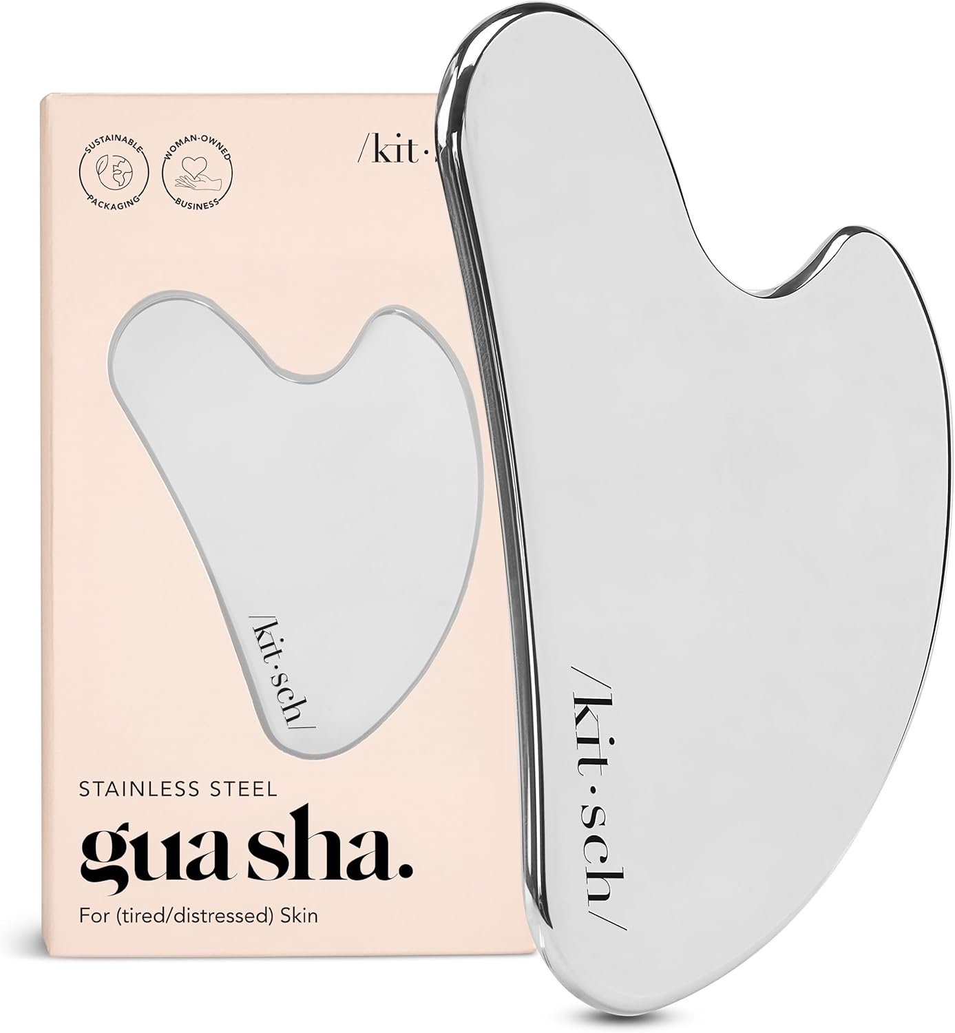 Stainless steel gua sha tool by Kitsch — kidney-shaped with notched upper edge for neck and jaw work