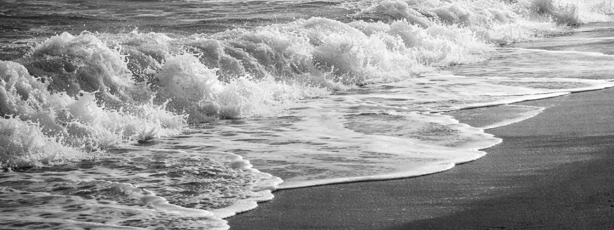 Calm ocean waves on a beach, a visual symbol of the gentle restorative approach of Self Care Sunday